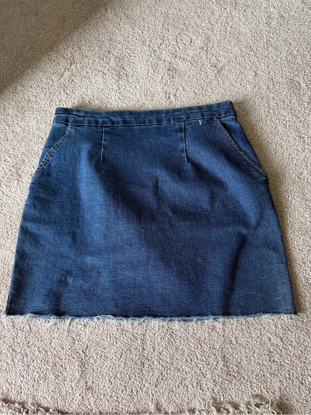 Dark Blue Denim Mini Skirt with Raw Hem. Evelyn